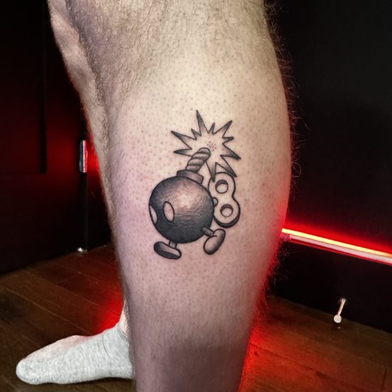 Picture of a bob-omb tattoo.