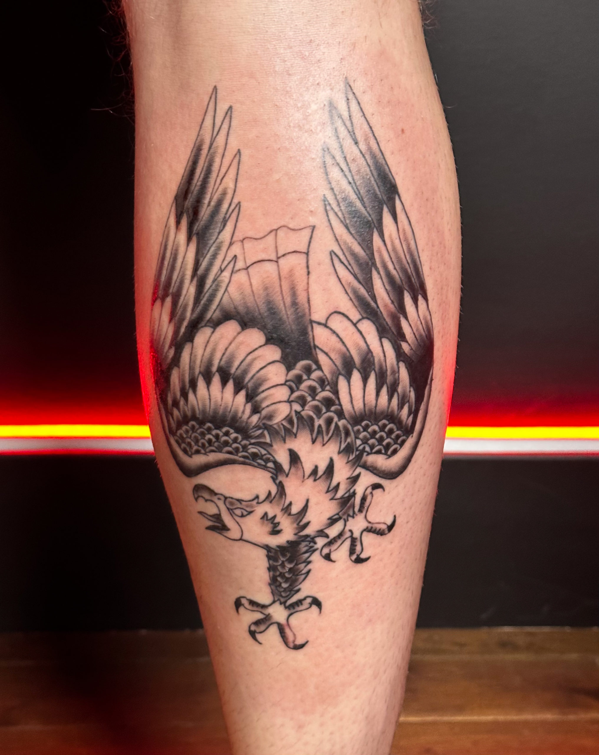 Pic of a traditional eagle leg tattoo.