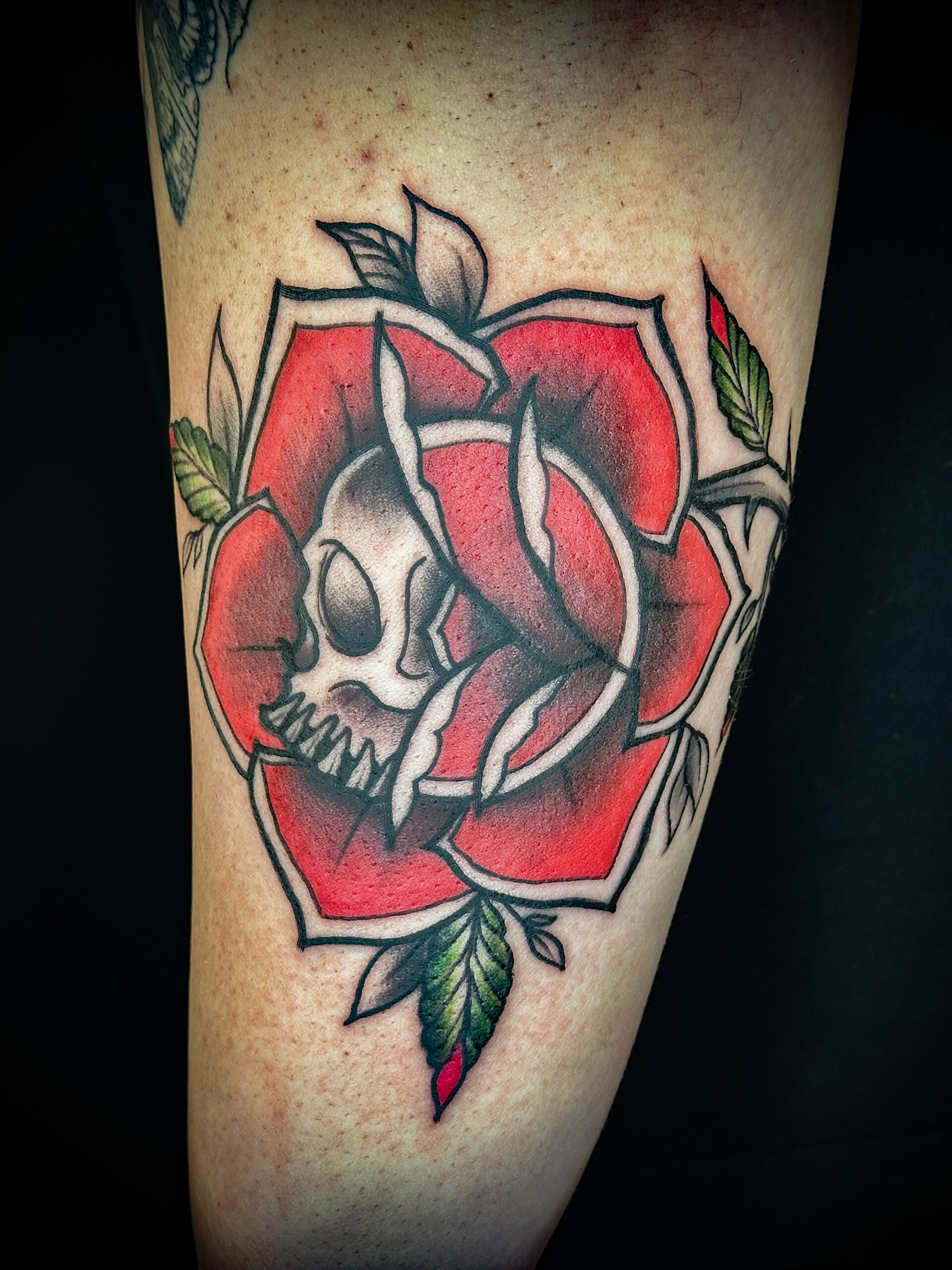 American traditional skull and rose tattoo